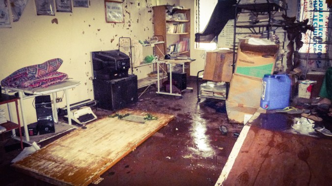 The office which was destroyed after winds blew unexpectedly from the west. The door of the office, which blew off its hinges, lies on the ground.